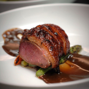 Roasted Duck with Cumin and Honey Glaze, Duck Fat-Poached Asparagus and Tamarind Curd