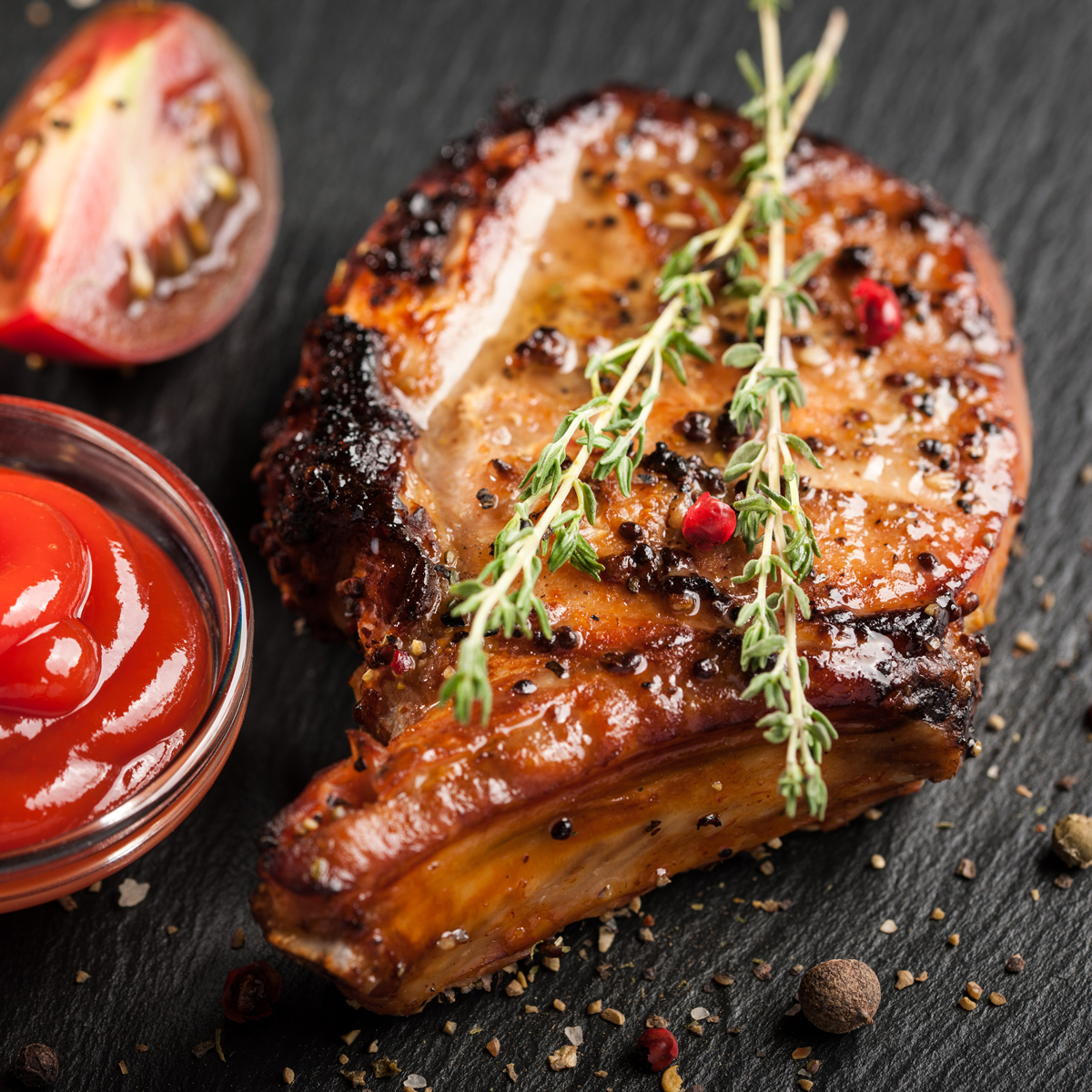 Grilled Applewood Smoked Pork Chop with Pressed Hard Cider Sauce
